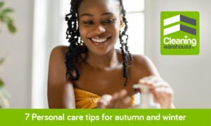 African lady in shower with towel around waist, promoting shower gel.
